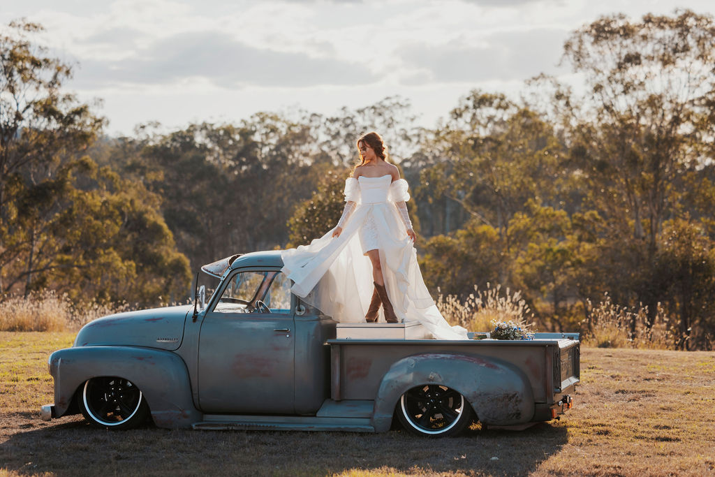 bride in ute on country property wedding in Gympie