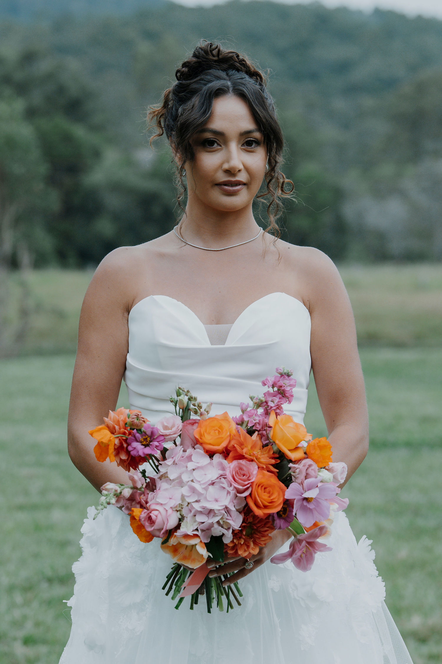 bride holding bright warm bridal bouquet