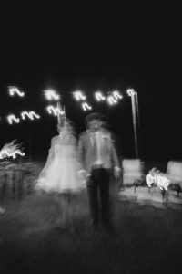 black and white image of bride and groom dancing at their Sunshine Coast wedding reception