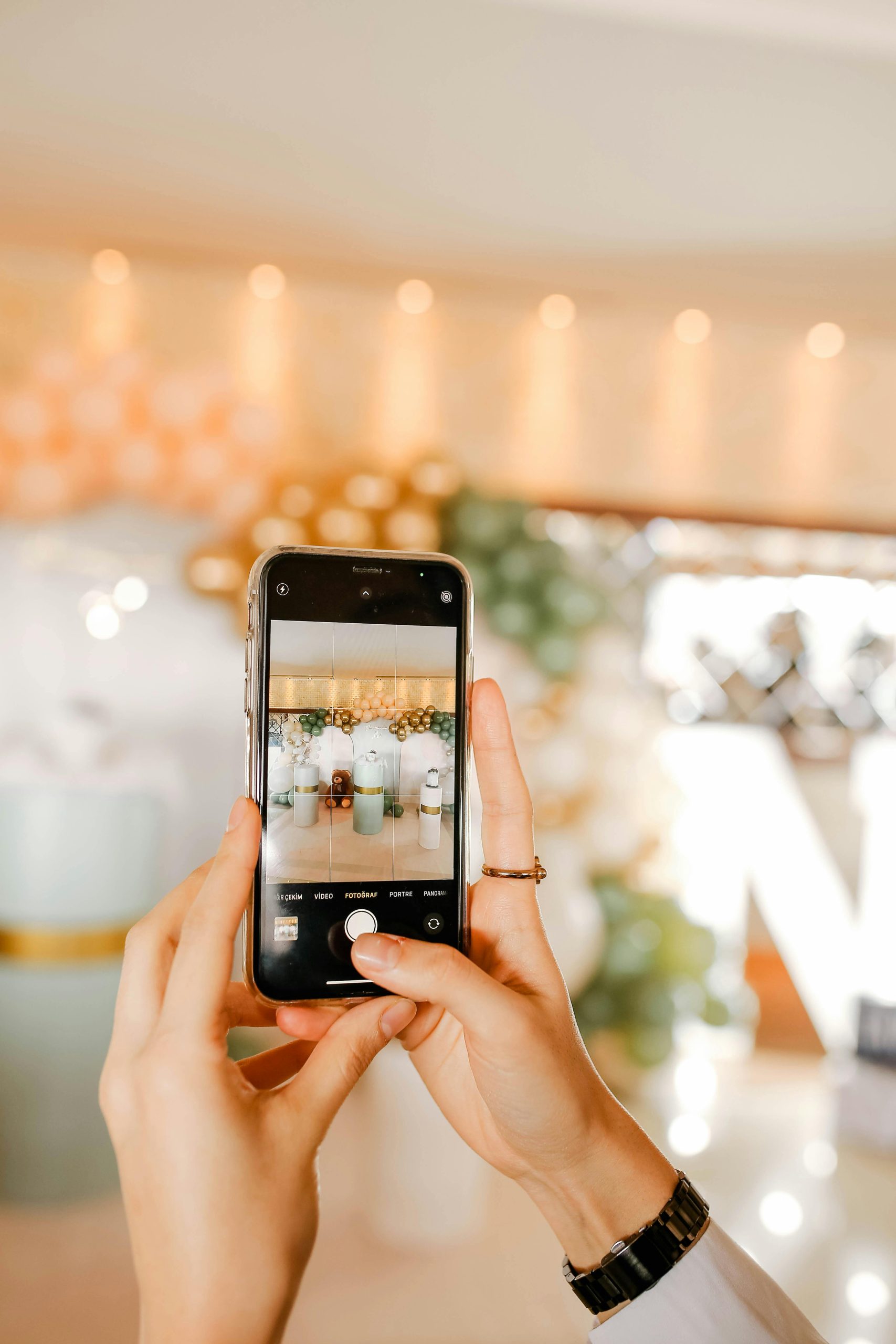 close up of smart phone taking photo of wedding styling set up