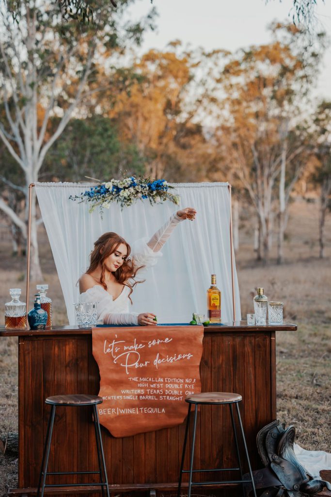 Gympie wedding venue rustic mobile bar with bride celebrating