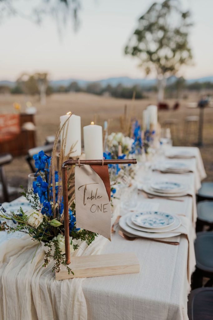 Gympie wedding venue tablescape for outdoor reception with blue and white details