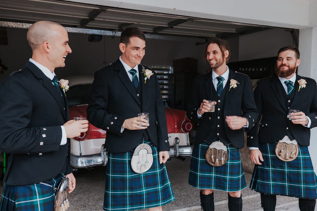 Scottish groom and groomsmen wearing kilts